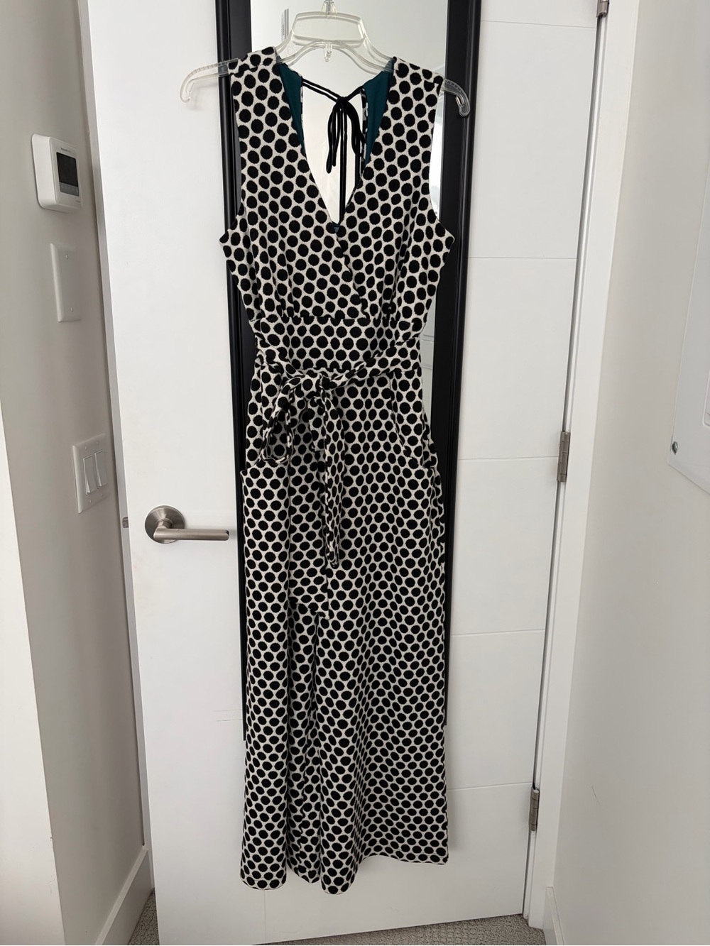 Sleeveless Black and White Polka Dot Jumpsuit with Waist Tie